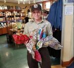 Photo: A refuge employee with balloons found during a beach cleanup